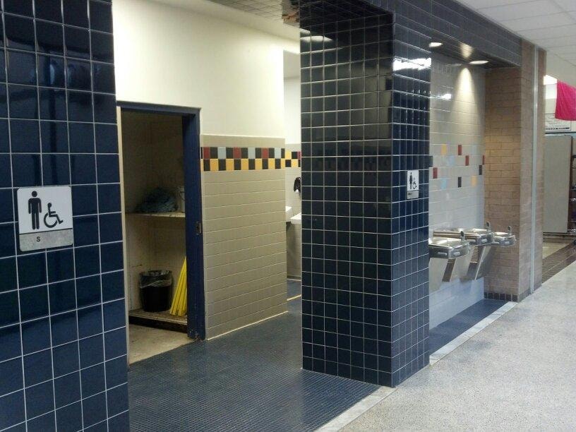 Completed accessible restroom entry and drinking fountain area