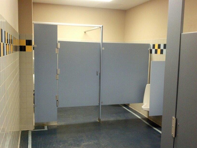 Completed public restroom with stall partitions