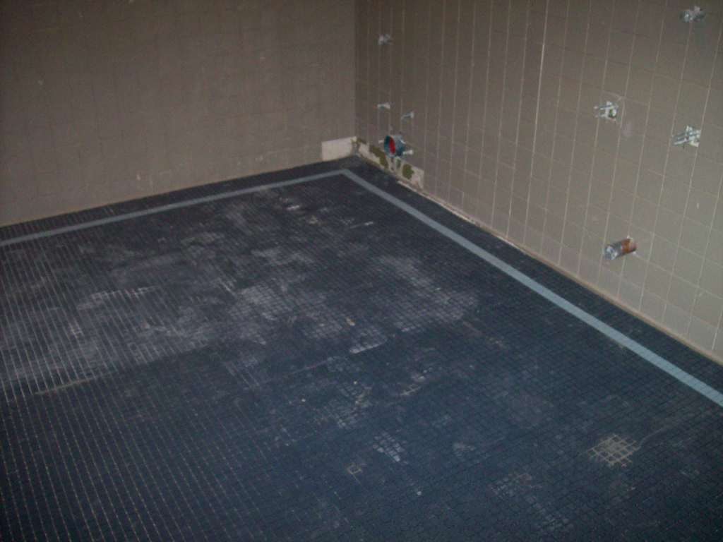 Restroom tile installation in progress
